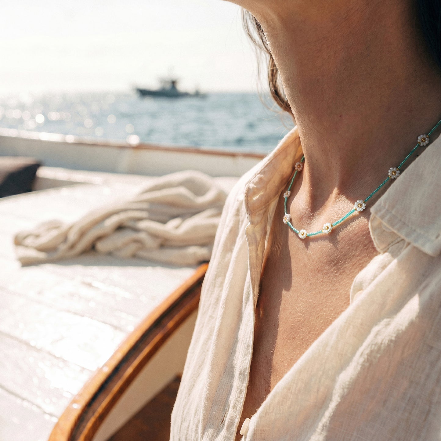 Collana margherite turchese